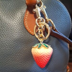 Strawberry Keychain on Leather Bag